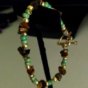 Bracelet with 14 kt gold accents and heart Clasp